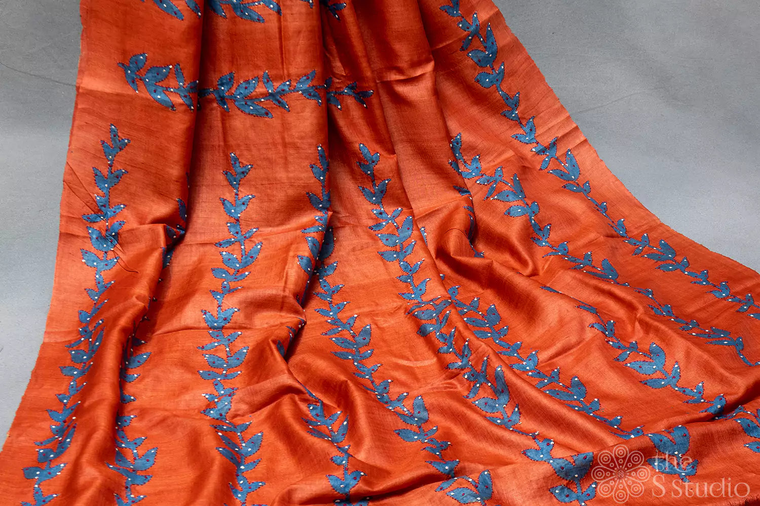 Orange tussar floral printed saree with embroidery